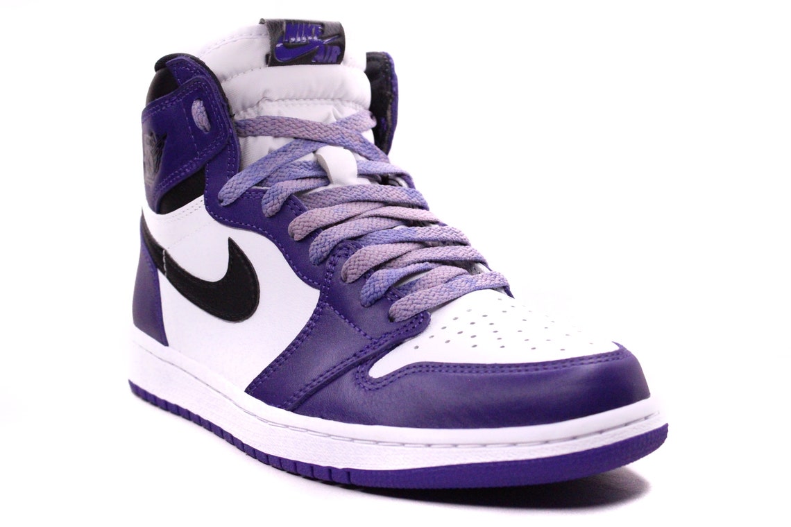 black shoes with purple laces