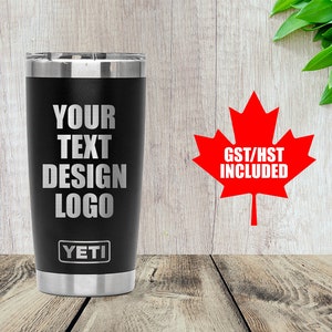 May include: A black Yeti tumbler with a silver rim and the text "YOUR TEXT DESIGN LOGO" in white. The Yeti logo is at the bottom. A red maple leaf with the text "GST/HST INCLUDED" is to the right.