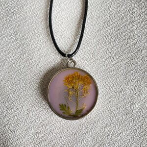 Pressed flower in resin pendant