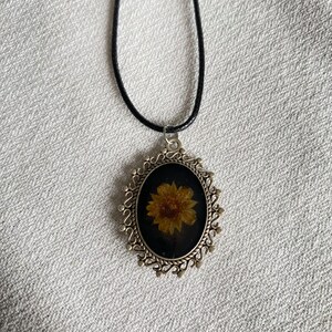 Pressed flower in resin pendant