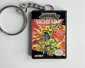 Nintendo Teenage Mutant Ninja Turtles 2: The Acrade Game Keychain - TMNT 2 - Nintendo Gift - Keychain - Magnet - Nintendo - TMNT 2