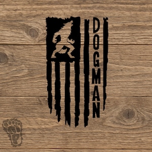May include: A black graphic decal featuring a stylized American flag design with a silhouette of a creature in the upper left corner and the vertical text DOGMAN on the right side, accompanied by a small footprint icon in the lower left corner.