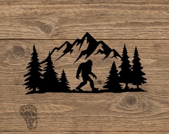 May include: A black silhouette decal featuring a walking Bigfoot creature centered in front of a mountain range and a forest of pine trees. A small footprint icon is positioned in the lower left corner of the design.