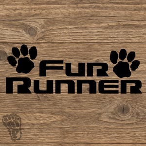 May include: A black vinyl decal featuring the text "FUR RUNNER" in a bold, blocky font, flanked by two black paw prints. A smaller, faint, outline-style paw print is positioned in the lower left corner of the design.