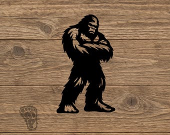 May include: A black silhouette graphic of a standing Bigfoot creature with arms crossed over its chest. The figure features shaggy fur details and a prominent brow. A small, separate black footprint icon is positioned in the lower left corner.