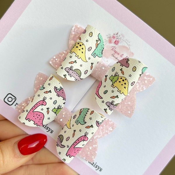 dinosaur hair bows. pink glitter piggy sets