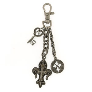 May include: Silver-toned key chain with a fleur-de-lis charm, a cross charm, a key charm, and a chain link charm.