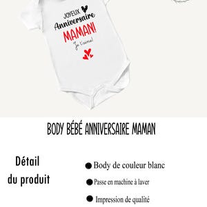 May include: White baby onesie with black text that reads "JOYEUX Anniversaire MAMAN! Je t'aime!" with a red heart and three smaller red hearts. The onesie is for a baby's first birthday.