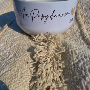 May include: White ceramic bowl with the text "Mon Papy d'amour..." in gold lettering and a gold heart.