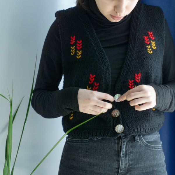 Hand-knitted women vest witk folk motifs