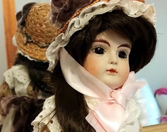 Asmerelda is my name. Reproduction doll by RRD 1980s. I have no markings of any particular mold you know but Im Bisque & ball socket head. X