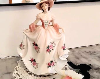 Royal Worcester Fine bone china "Sweet Rose" figurine in excellent vintage condition. A hand numbered limited edition 7,549 of 9,500 made.