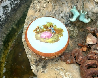 A Regency French styled Vintage Limoges trinket box 1970s. Fine porceline.  Romantic Pastoral pretty couples scene from a Fragonard painting