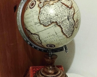Harvey Makin Vintage world  Antique map preproduction Globe in excellent condition.  Standing at 31cm tall. Hard solid wooden stand .