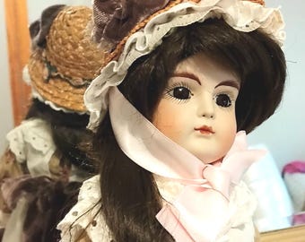 Asmerelda is my name. Reproduction doll by RRD 1980s. I have no markings of any particular mold you know but Im Bisque & ball socket head. X