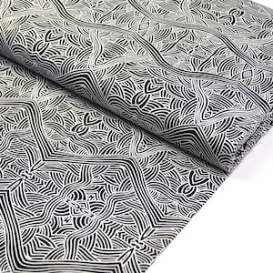 May include: Black and white fabric with a geometric pattern of overlapping lines and curves. The fabric is folded in half, showing the pattern on both sides.