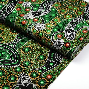 May include: Green, black, white and orange fabric with an Aboriginal-inspired pattern of dots, circles and lines. The fabric features a repeating design of birds and other abstract shapes.