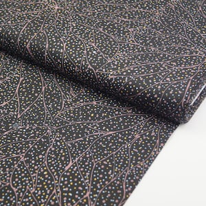 May include: Black fabric with a pink and white leaf pattern. The fabric is covered in small white, pink, and yellow dots.