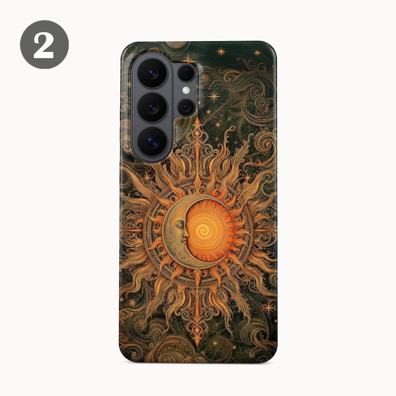 May include: A rectangular smartphone case featuring a detailed illustration of a crescent moon with a human face overlapping a radiant sun. The design includes intricate golden swirls, star patterns, and dark green textures throughout the surface.