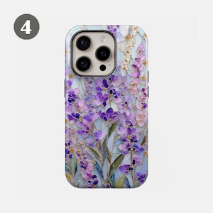 May include: A phone case featuring a floral design with purple lavender flowers and green leaves. The case has a light blue background and a glossy finish. The phone case is designed for a smartphone.