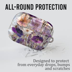 May include: A protective case with a floral design, featuring purple, white, and orange flowers. The text reads "ALL-ROUND PROTECTION" and "Designed to protect from everyday drops, bumps and scratches."