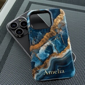 May include: A blue and gold marble phone case with the name Amelia printed on the bottom.