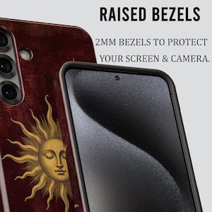May include: A dark red smartphone case featuring a gold sun illustration with a face. The case has raised bezels and text that reads RAISED BEZELS 2MM BEZELS TO PROTECT YOUR SCREEN & CAMERA. The case includes cutouts for a triple camera system.