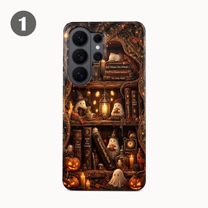 May include: A smartphone case featuring a detailed illustration of a wooden bookshelf filled with books, small white ghosts, glowing lanterns, and orange pumpkins. The scene includes warm lighting, autumn leaves, and various book titles printed on the spines.