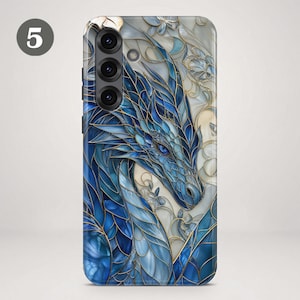 May include: A smartphone case featuring a stained glass design of a blue dragon with intricate gold outlines. The dragon is set against a background of white and cream floral patterns, with a prominent number 5 in the upper left corner.