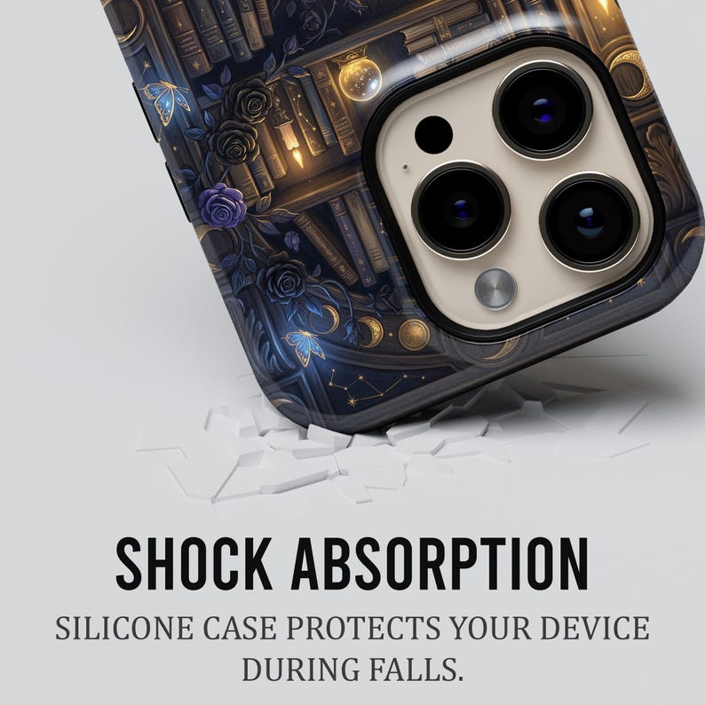 May include: A smartphone case with a detailed design featuring a bookshelf, butterflies, roses, and celestial elements in shades of blue, gold, and purple. The case has a glossy finish and the text "SHOCK ABSORPTION" is visible.