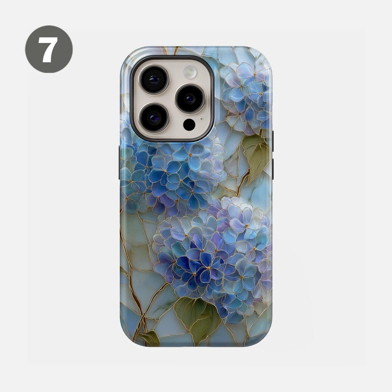 May include: A phone case featuring a floral design with blue and purple hydrangea flowers. The case has a glossy finish and a black camera lens area. The flowers have gold-colored outlines and green leaves.