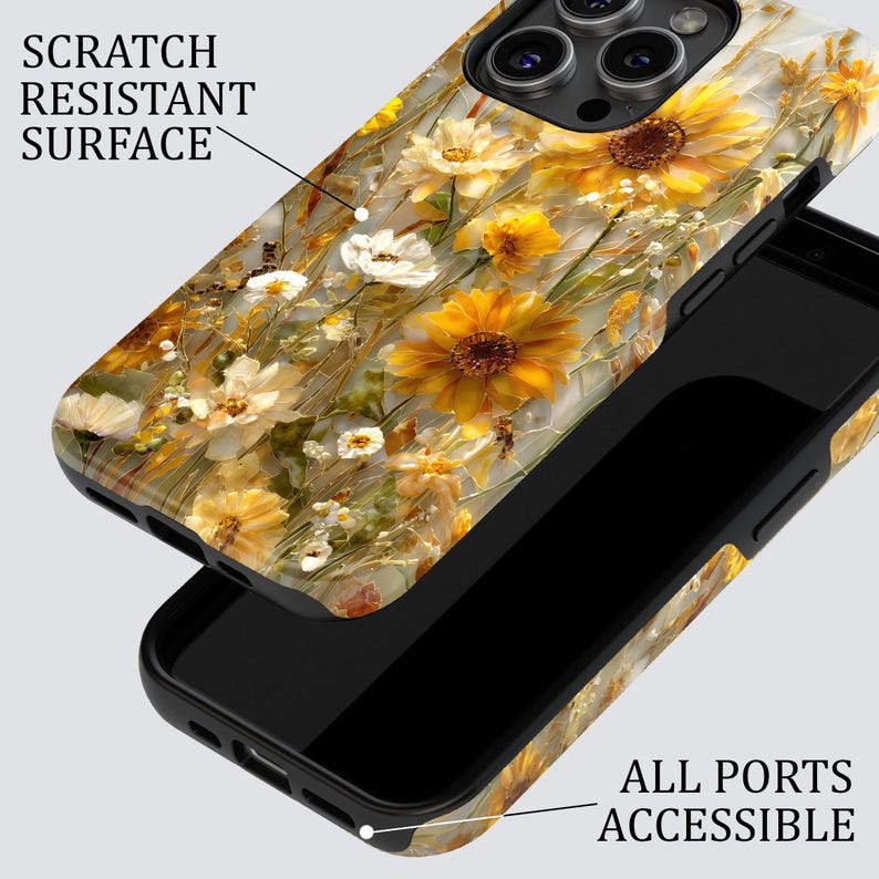 May include: A phone case with a floral design featuring yellow sunflowers and white wildflowers. The case has a scratch-resistant surface and is designed to allow access to all ports. The text "SCRATCH RESISTANT SURFACE" and "ALL PORTS ACCESSIBLE" are visible.