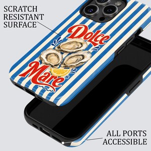 May include: A phone case with a blue and white striped pattern. The case features the words "Dolce Mare" in red script, along with illustrations of oysters and a lemon slice. The case is designed to protect the phone's surface.