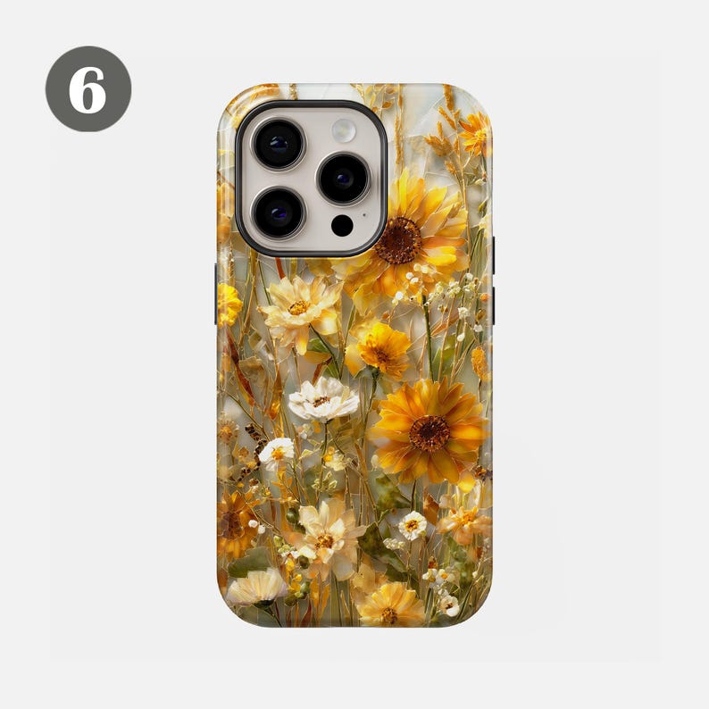 May include: A phone case featuring a floral design with sunflowers and other yellow and white flowers. The case has a glossy finish and a black border. The design is a mix of painted and photographic elements.