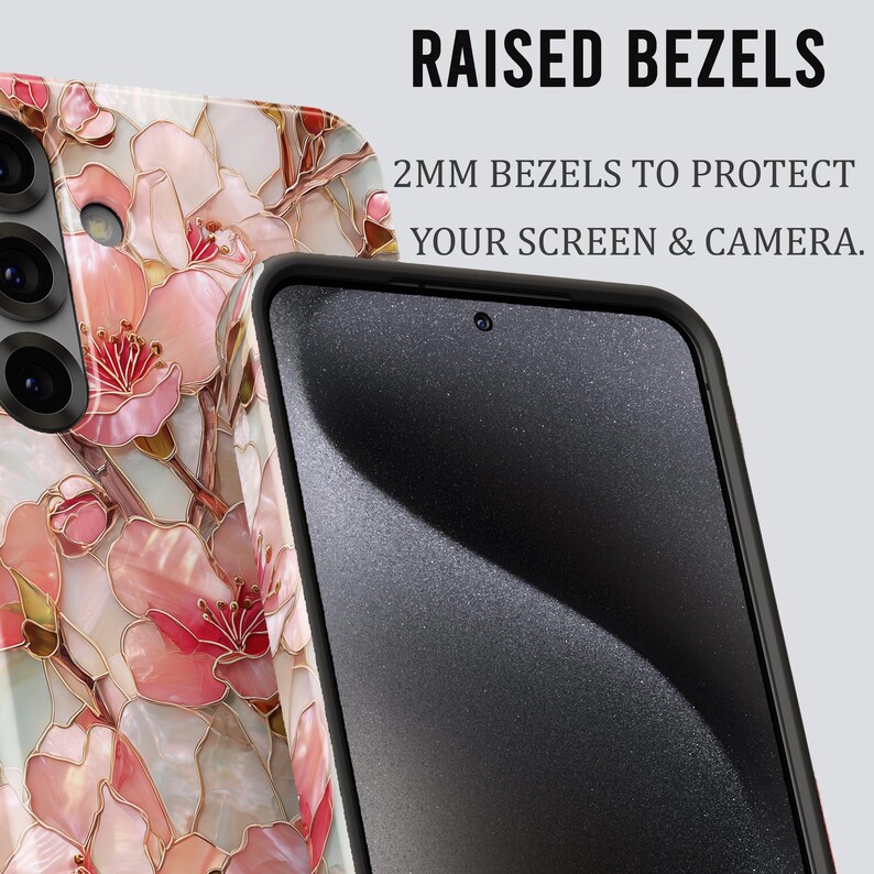 May include: A smartphone case with a floral design in shades of pink, white, and gold. The case has raised bezels for screen and camera protection. The text on the image reads "RAISED BEZELS" and "2MM BEZELS TO PROTECT YOUR SCREEN & CAMERA."