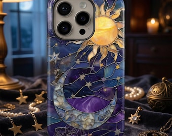 May include: A celestial-themed phone case featuring a stained-glass design. The case showcases a golden sun, a crescent moon, and numerous stars against a deep blue and purple background. The case is designed for a smartphone.
