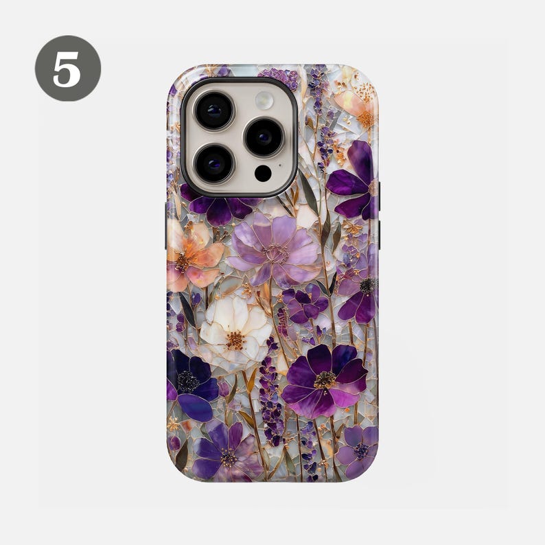 May include: A phone case featuring a floral design with purple, white, and orange flowers. The case has a glossy finish and a raised design, with a camera cutout on the top.
