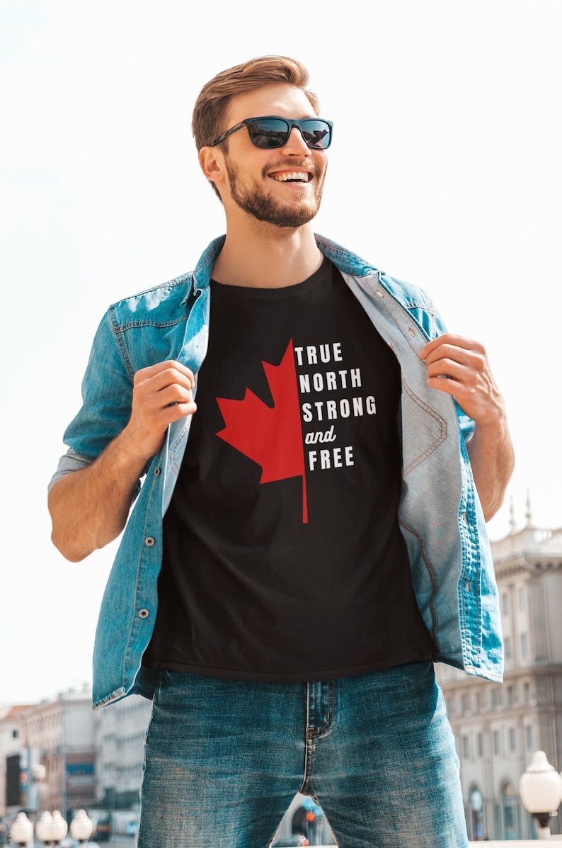 May include: A black t-shirt with a red maple leaf and the text "TRUE NORTH STRONG and FREE".