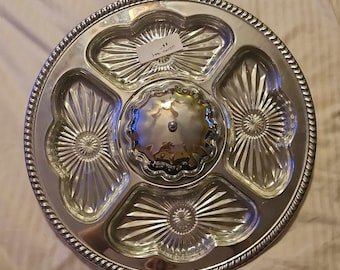 May include: Silver serving tray with four individual glass dishes and a central dome. The dishes have a cut glass design.