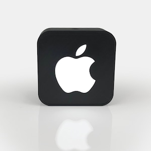 May include: A black square-shaped device with a white Apple logo in the center.