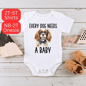 Every Dog Needs A Baby Onesie® ~ Pet Lover Baby Onesie® ~ Newborn Baby Onesie® ~  Cavalier King Charles Spaniel Dog Baby Onesie®