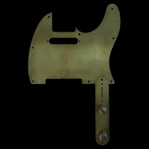 May include: A white ceramic mug with a black handle and the text "But First, Coffee" in a bold, black font. The mug is set against a blurred background, suggesting a cozy setting.