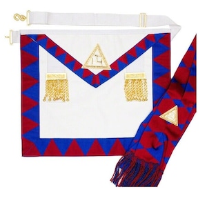 May include: A white Masonic apron with a blue and red border, a gold triangle emblem, and gold tassels. A matching red and blue sash with a gold triangle emblem and tassels is included.