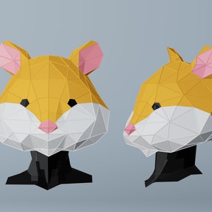 May include: Two 3D-rendered hamster heads, one facing forward and the other in profile. The hamster heads are constructed from geometric shapes in shades of gold, white, black, and pink. The background is a solid light gray.