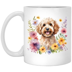May include: White ceramic mug with a watercolor illustration of a golden doodle dog surrounded by colorful flowers.