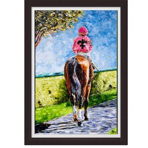 May include: Oil painting of a racehorse and jockey framed in a dark wood frame. The jockey wears a pink cap and jacket with a black fleur-de-lis. The horse is brown and white, walking on a paved path with green grass and a blue sky background.