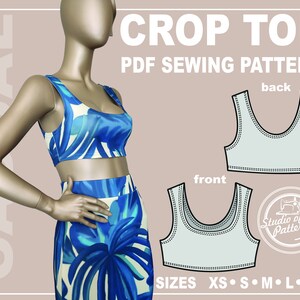 May include: A blue and white patterned crop top and skirt set on a mannequin. The image includes a PDF sewing pattern with front and back views of the crop top, and the text "CROP TOP PDF SEWING PATTERN" and "SIZES XS S M L XL".