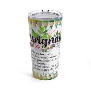 May include: A white stainless steel tumbler with a colorful design of pencils and flowers. The tumbler has the word "enseignant" written in black with a definition in French.