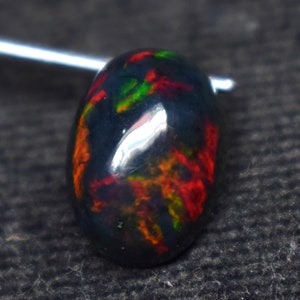 AAA++ calidad 3 quilates Galaxy Fire negro liso piedra preciosa de ópalo etíope, piedra preciosa de ópalo de forma ovalada, tamaño 13X9.5X6.1 MM ópalo ahumado