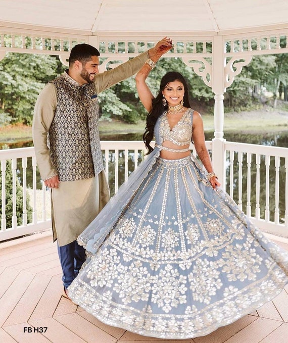 Manish Malhotra - Colours of summer, fillers of grandeur, so much to  discover The 500 hour of serene labour full ensemble is a raw silk ivory  and silver kadana embriodered geometric lehenga